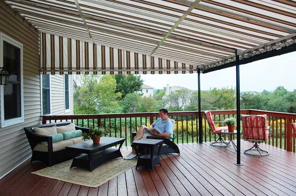 man enjoying the cool shade of a deck awning window works nj