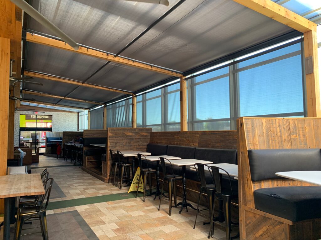 KE Outdoor Design Pinnacle shading system over glass solarium